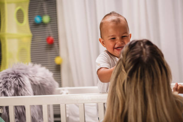 istock Cute baby playing with mom 1199331522