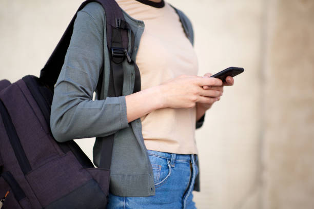 istock Close up female hands holding mobile phone 1199331593