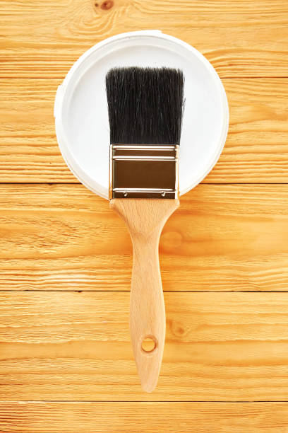 istock Painting brush on can with white paint. 1199331655