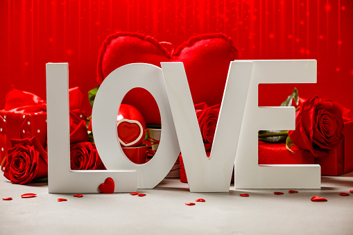 Valentine's Day concept. Love wooden letters on rustic background