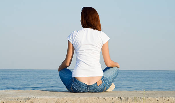 istock Young female looking to the ocean 119933540