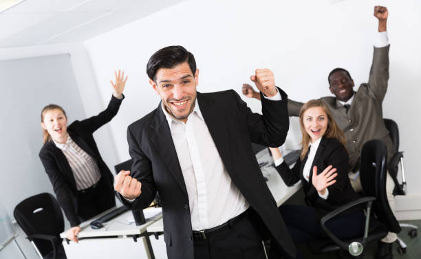 istock International business team expressing satisfaction with teamwork 1199336346