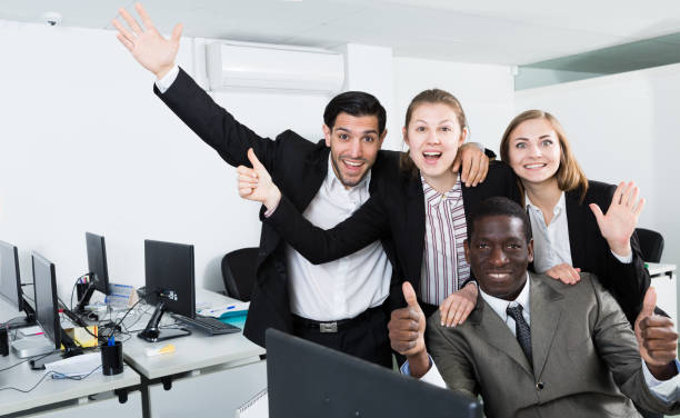 istock Satisfied business group enjoying their success 1199336347