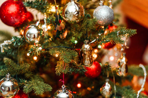 istock Christmas tree gold decorations and garland 1199336544