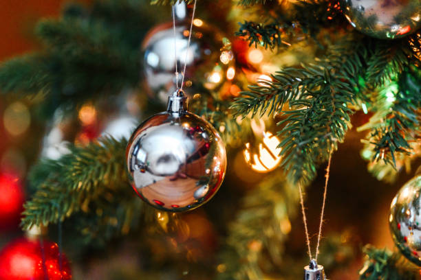 istock christmas-tree decoration bauble on decorated Christmas tree 1199336564
