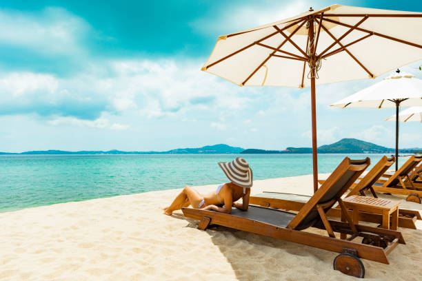 Woman in beach chair on tropical beach