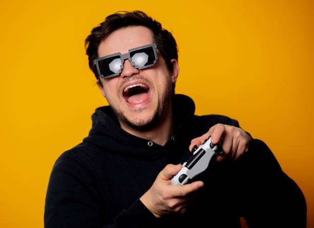 istock man sunglasses keen plays with a joystick 1199337464