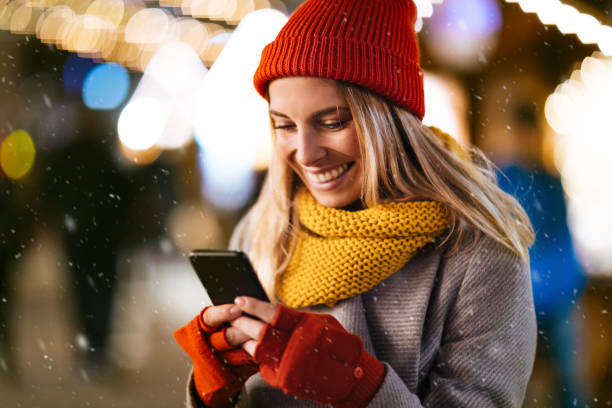 istock Woman sending message on New Year's Eve 1199337596