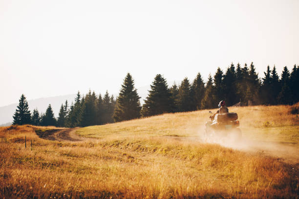 istock Adventurous couple cruising on a quad vehicle 1199340722