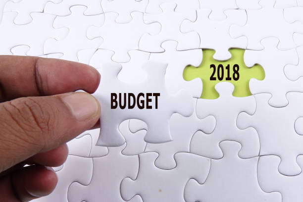 istock BUDGET 2018 CONCEPT: Missing piece of puzzle on white background 1199345752