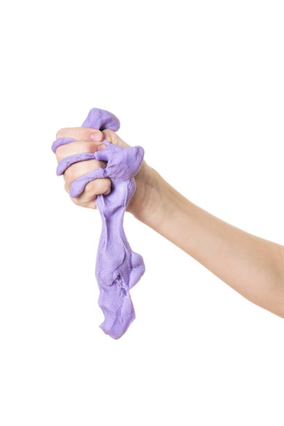 istock Lilac slime and baby's right hand isolated on white background. 1199349094
