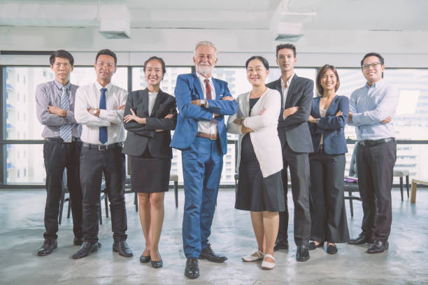 istock Group of young multiethnic diverse people gesture hand high five, laughing and smiling together in brainstorm meeting at office. Casual business with startup teamwork community celebration concept 1199352249