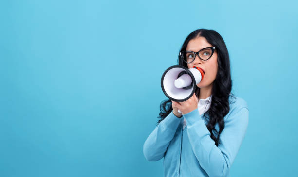 istock Young woman with a megaphone 1199352796