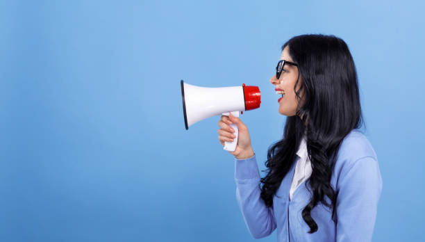istock Young woman with a megaphone 1199352799