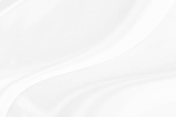istock White gray satin texture that is white silver fabric silk background with beautiful soft blur pattern natural. 1199362327