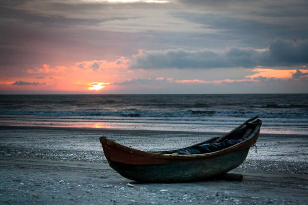 istock sunset fisher boat 1199364114