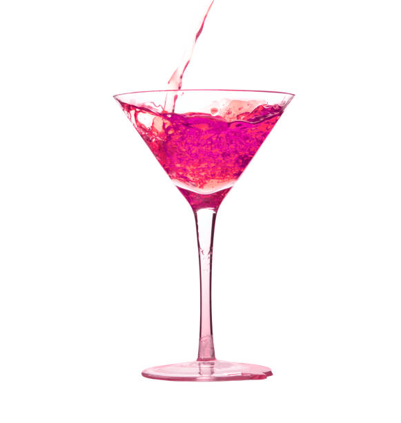 istock Pouring pink liquid drink into cocktail martini glass 1199365203