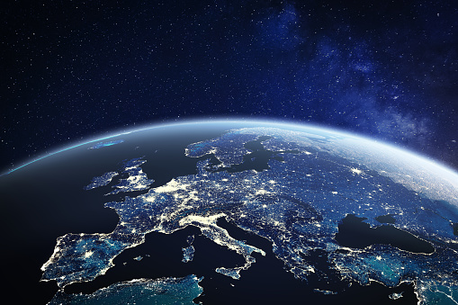 Europe viewed from space at night with city lights in European Union member states, global EU business and finance, satellite communication technology, 3D render of planet Earth, world map from NASA (https://eoimages.gsfc.nasa.gov/images/imagerecords/57000/57752/land_shallow_topo_2048.jpg)