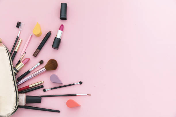 istock Make-up cosmetic bag against pink background, copy space 1199377590