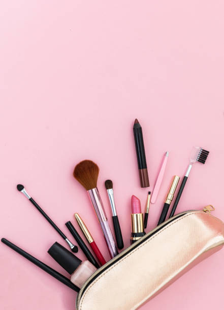 istock Make-up cosmetic bag against pink background, copy space 1199377593