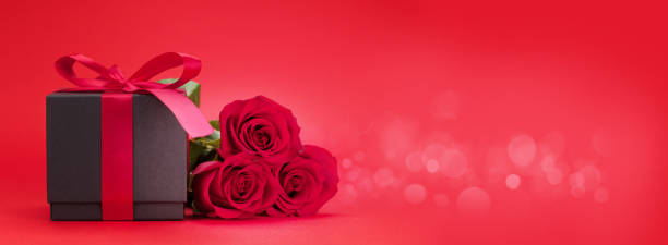 istock Valentines day gift box and roses bouquet 1199377767