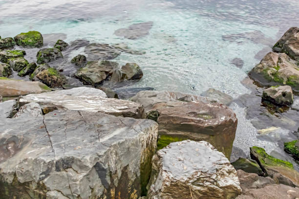istock shore cliffs and clear sea in winter season 1199378736