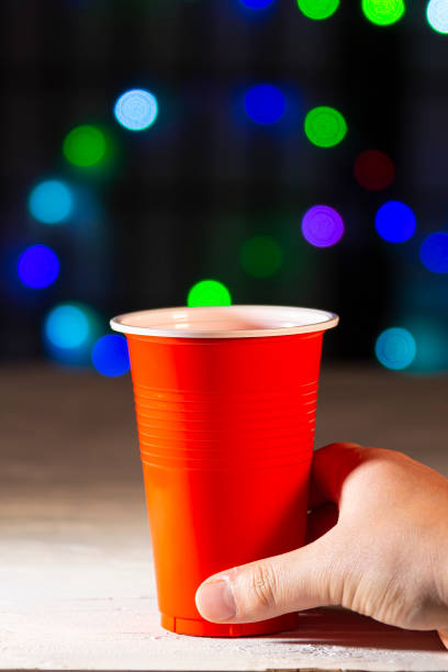 Rows of red drinking cups. Conceptual poster. Zero waste plastic free ocean nature pollution environmental conservation concept. Design template
