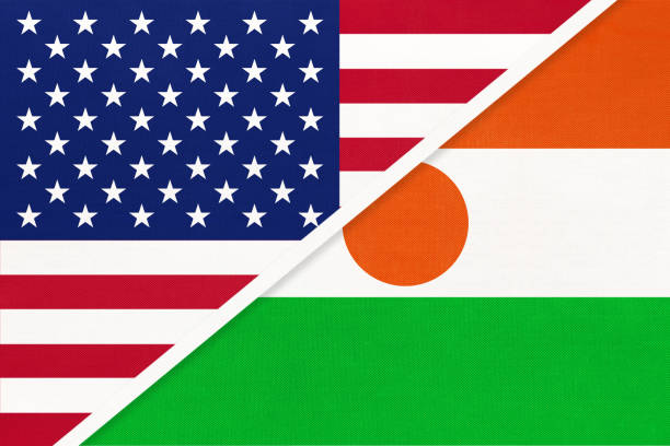 istock USA vs Niger national flag from textile. Relationship between two american and african countries. 1199379685