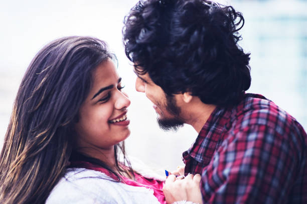 istock Young couple romancing at the apartment balcony 1199381440