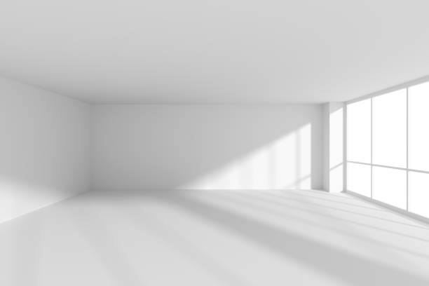 istock Empty white business office room with sunlight from large windows. 1199382115