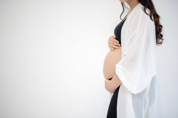 istock Pregnant women are showing 1199382725