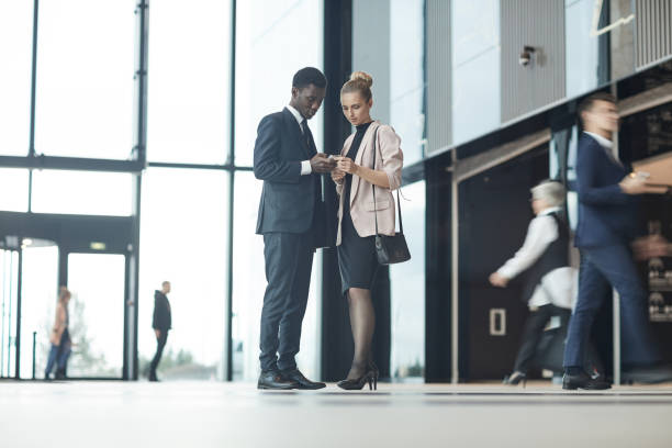 istock Business partners using phones 1199382871