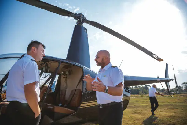 Photo of Helicopter pilots consulting before the flight