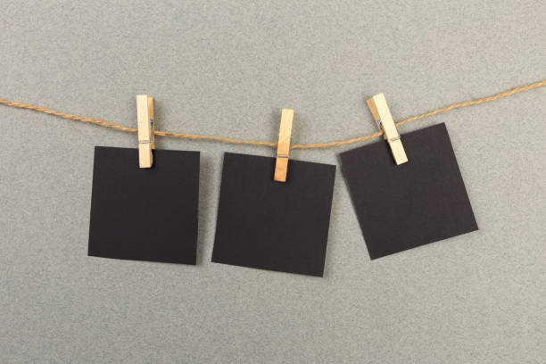 istock collection of various notes and a clothes pegs on grey background with clipping path 1199392053