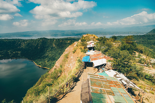 Homes seen on the active Taal Volcano island in Luzon Batangas Philippines. The homes are located just next to the active crater of the volcano.
