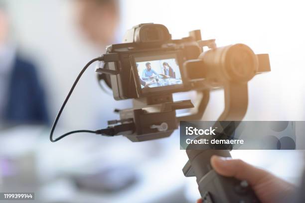 Professional Videomaker Shooting A Video Stock Photo - Download Image Now - Home Video Camera, Filming, Movie