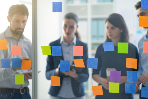 istock Young business team working together in the office 1199399290