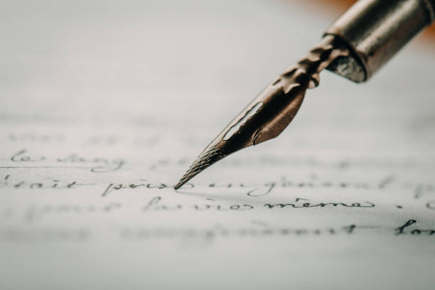 istock fountain pen on paper with ink text closeup 1199400623