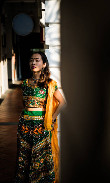 istock Asian Girl leaning on a wall 1199401183