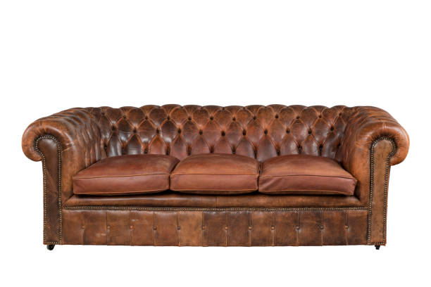 Classic brown leather sofa isolated on white original old Brown soft leather luxurious sofa isolated on white leather couch stock pictures, royalty-free photos & images