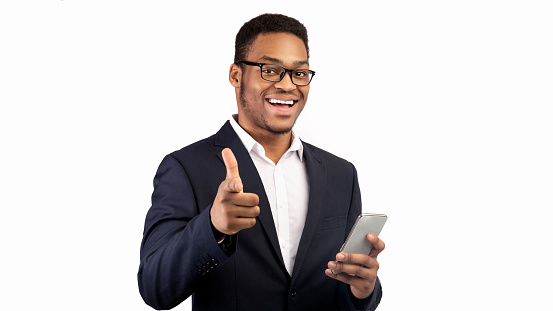 Hey You. Portrait of african american businessman pointing finger at camera, choosing leader, panorama, free space