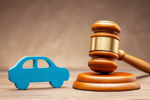 Car and judge gavel on brown background. Concept of selling a car by auction or accident sentence stock photo