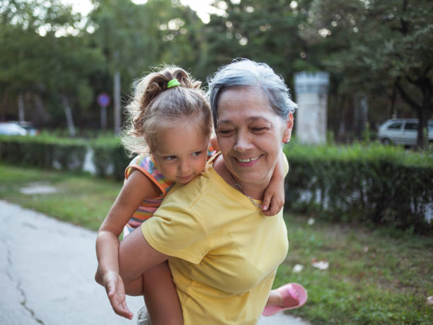 istock Grandma holding her granddaughter 1199402538