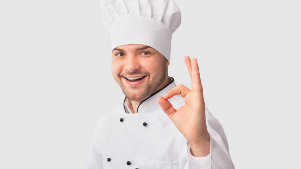 istock Confident Chef Man Gesturing Okay Approving Recipe, White Background 1199402970