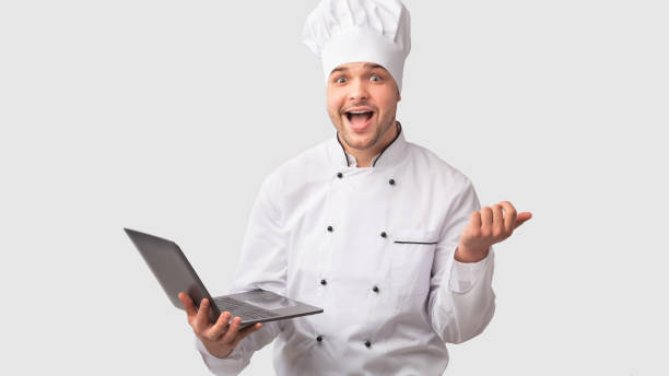 istock Cook Man Holding Laptop Standing Over White Studio Background, Panorama 1199403167