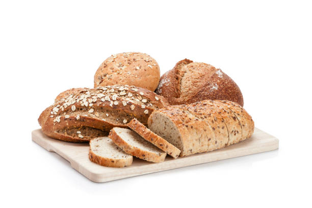 istock Various loaves of bread heap shot on white background 1199406091