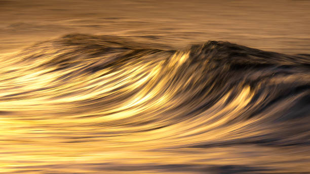 istock Photo of wave water textures at sunset with in camera panning technique 1199406212