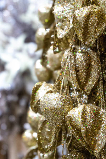 istock Decorated Christmas tree, wreath, with golden patchwork ornament artificial gold balls and big gift presents for new year isolated 1199408158