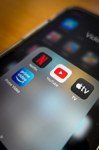 Italy, Rome - January 14 2020: The icon of the streaming app YouTube, surrounded by other competitors app the screen of an iPhone. The main competitor for Youtube are today Amazon Prime, Apple TV and Netflix.