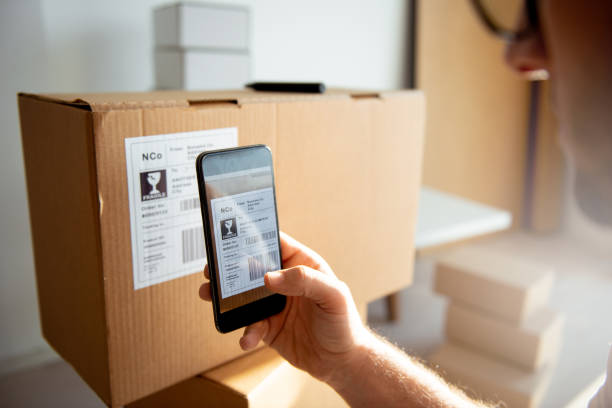 istock Delivery service, scanning a shipping label 1199408409